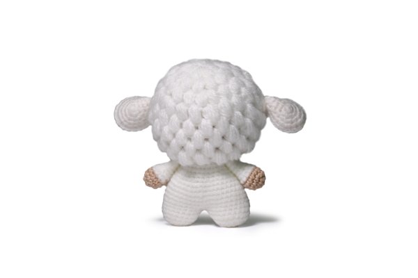 Completed Sheep amigurumi on white background.