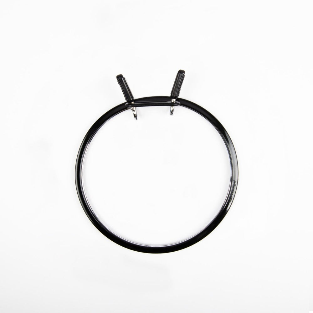 Nurge embroidery hoop with spring tension for secure fabric.