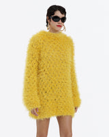 Circulo Natural Luxury Decor - Fluffy  Effect Yarn, 180 m / 280 g - Person wearing a yellow fluffy sweater on a white background