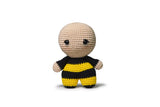 Bee amigurumi in progress with yarn and hook.